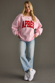 light pink and red apres sweatshirt, apres sweatshirt, light pink sweatshirt, oversized sweatshirt, women's sweatshirt, ski trip