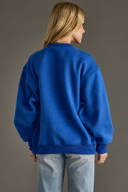 blue and green apres sweatshirt, apres sweatshirt, blue sweatshirt, oversized sweatshirt, colorful sweatshirt, women's sweatshirt, ski trip