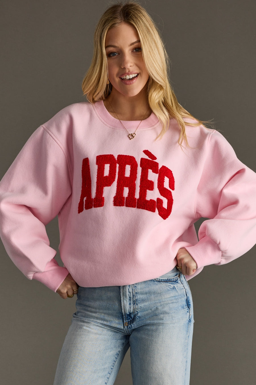 light pink and red apres sweatshirt, apres sweatshirt, light pink sweatshirt, oversized sweatshirt, women's sweatshirt, ski trip