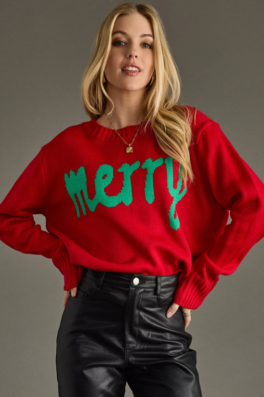 Person wearing a red sweater with green text on a gray background