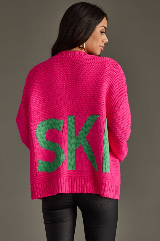 pink knit ski cardigan, ski cardigan, bright pink ski cardigan, winter cardigan, colorful cardigan, ski trip, ski vacation, women's cardigan