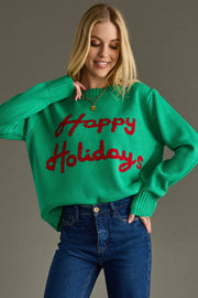 Woman wearing a green sweater with 'Happy Holidays' text on a gray background