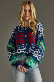 Woman wearing a colorful patterned sweater against a gray background
