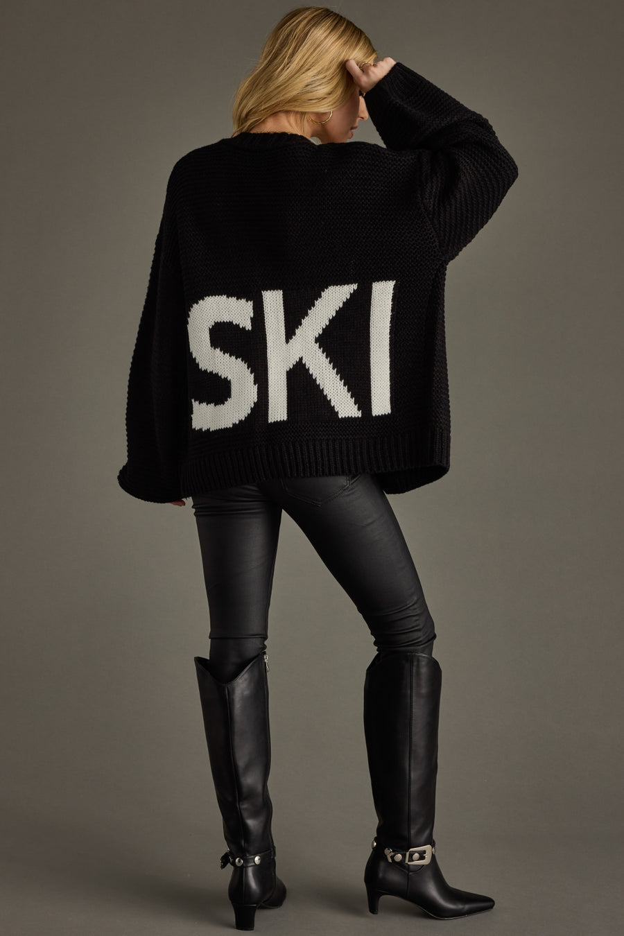 black knit ski cardigan, ski cardigan, black cardigan, women's cardigan, ski trip, ski vacation, neutral cardigan