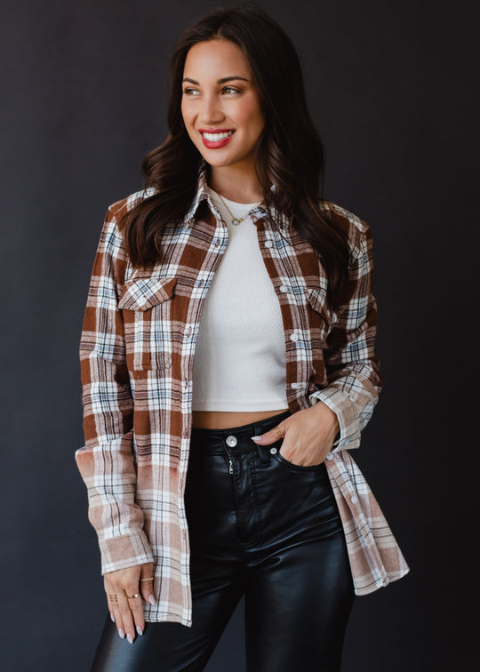 brown, black, blue and white plaid flannel