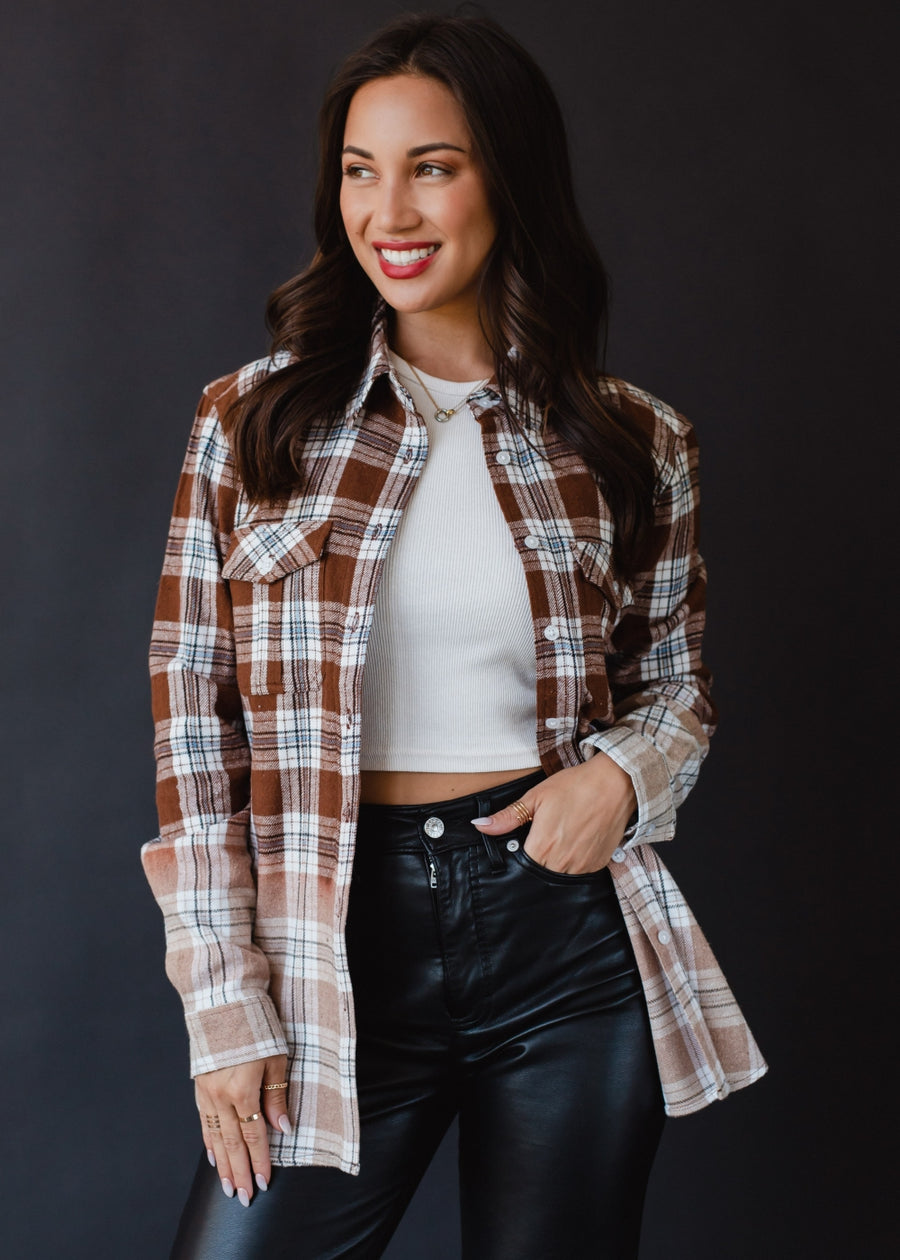 brown, black, blue and white plaid flannel