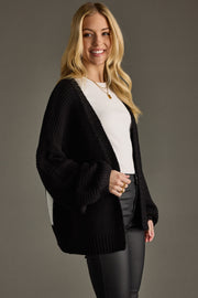 black knit ski cardigan, ski cardigan, black cardigan, women's cardigan, ski trip, ski vacation, neutral cardigan