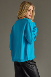 blue and pink ski sweater, ski sweater, bright blue sweater, colorful sweater, women's sweater