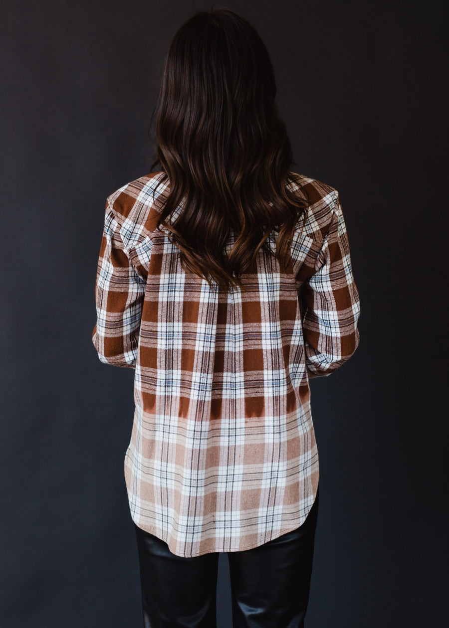 brown, black, blue and white plaid flannel
