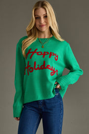 Woman wearing a green sweater with 'Happy Holidays' text on a gray background
