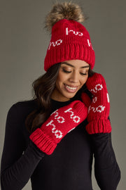 Woman wearing a red knit hat and mittens with white text on a gray background