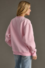 light pink and green apres sweatshirt, apres sweatshirt, light pink sweatshirt, oversized sweatshirt, colorful sweatshirt, women's sweatshirt, ski trip