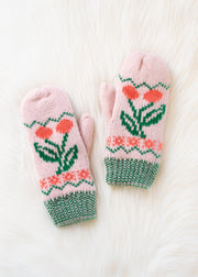 Pair of pink mittens with floral pattern on a white background