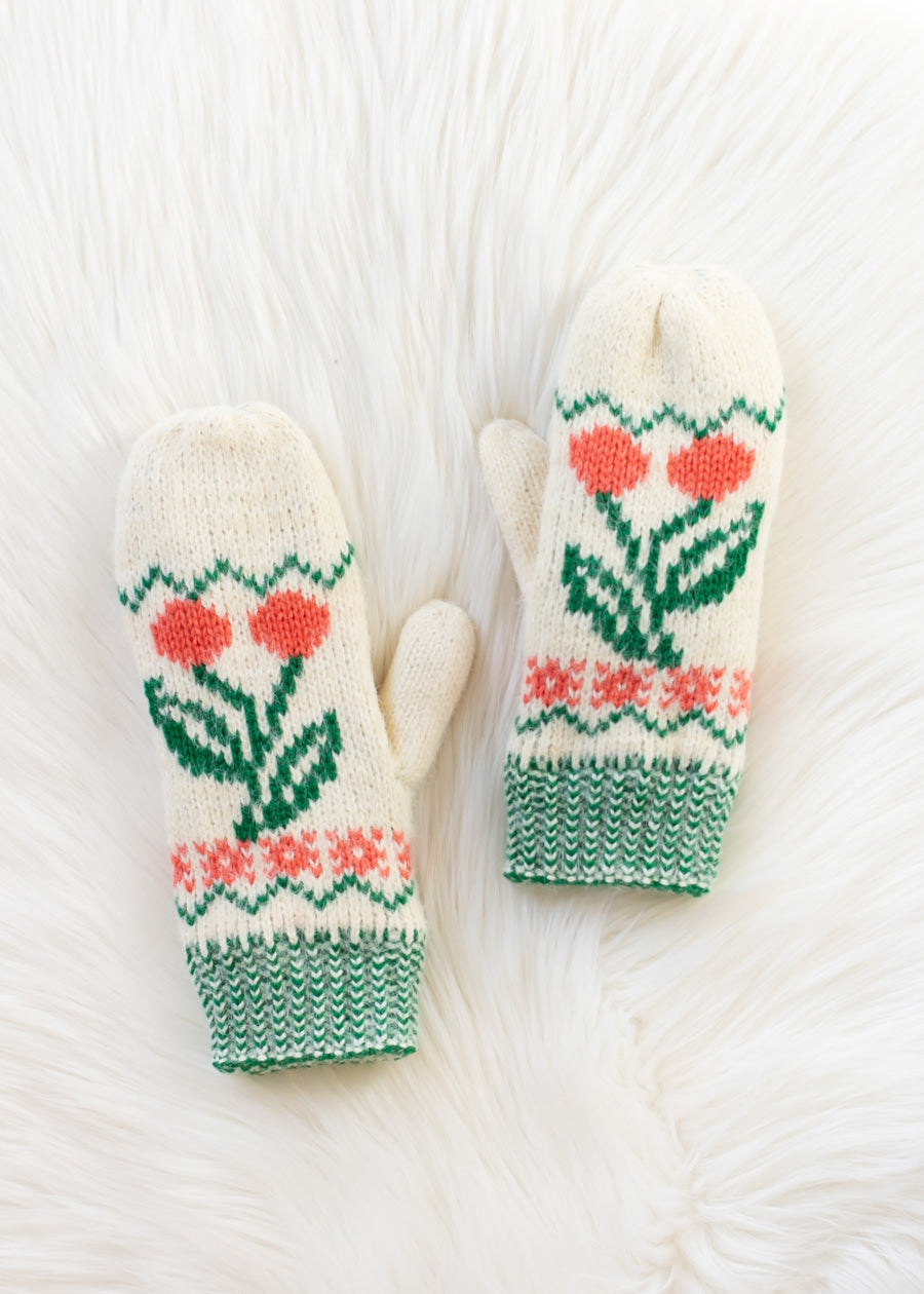 Pair of white mittens with floral pattern on a white background