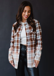brown, black, blue and white plaid flannel