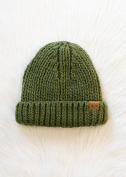 Green knit beanie with a brand logo on a white background