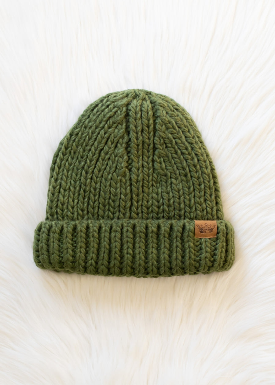 Green knit beanie with a brand logo on a white background