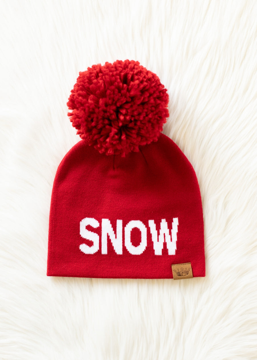 Red beanie with a pom-pom and 'SNOW' text on a white background