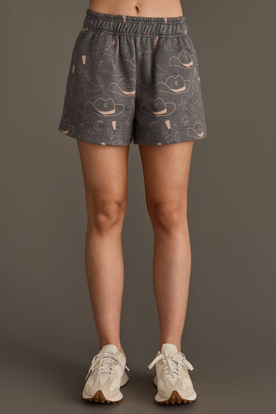Woman wearing Panache Apparel’s gray western print lounge shorts.