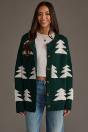 Woman wearing a Green Button Up Tree Cardigan from the Panache Apparel Collection over a white crop top and blue jeans.