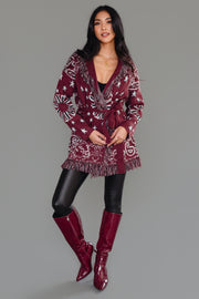 Full-body front view of Panache Apparel’s burgundy bandana fringe cardigan tied at the waist.