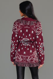Back view of Panache Apparel’s burgundy bandana fringe cardigan showing the bandana print and fringe detail.