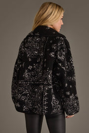 Back view of Panache Apparel’s black and white paisley fleece coatigan showcasing the allover paisley pattern and relaxed fit.
