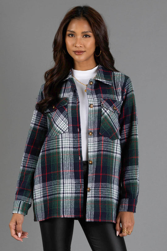 A woman with long brown hair is wearing the Panache Apparel Collection Navy, Green, White & Red Plaid Jacket over a white top and black pants, standing against a plain gray background.