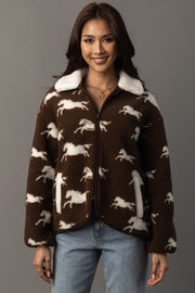 Woman wearing Panache Apparel’s brown and white fleece horse jacket, front studio view.