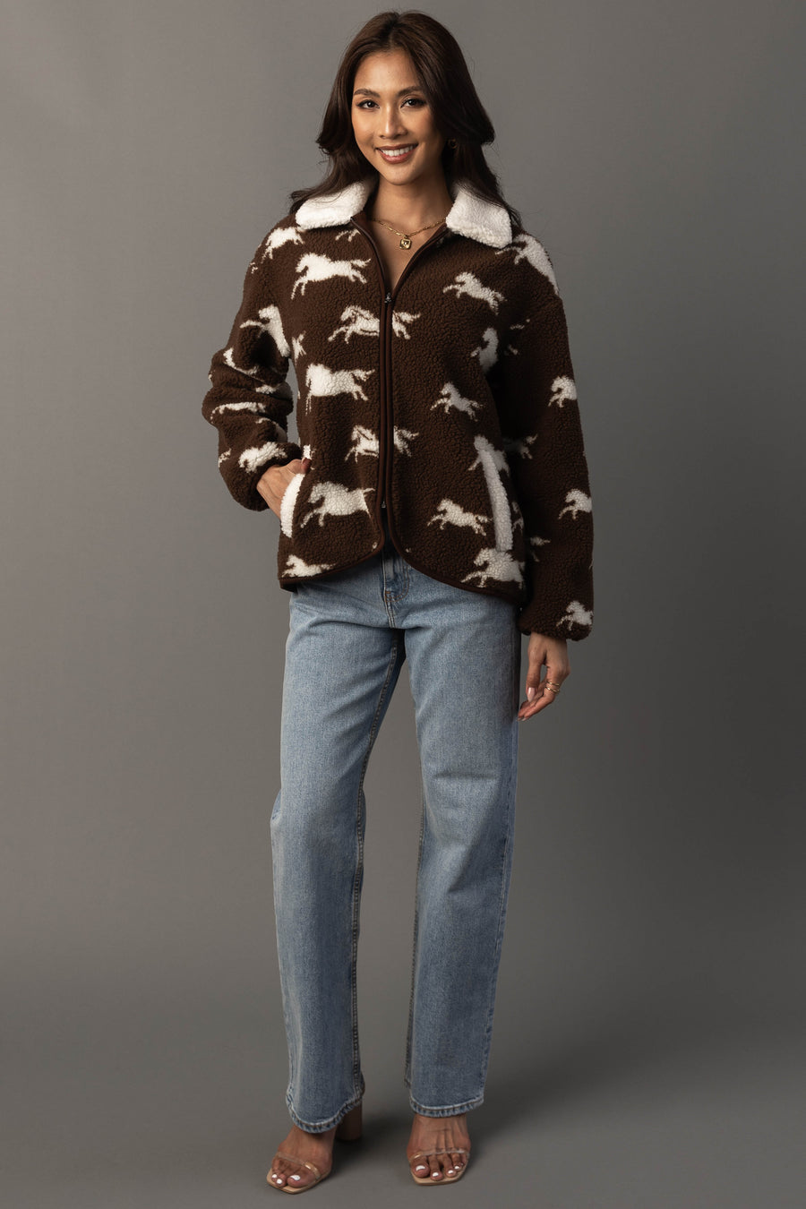 Full-length studio image of Panache Apparel’s brown and white fleece horse jacket.