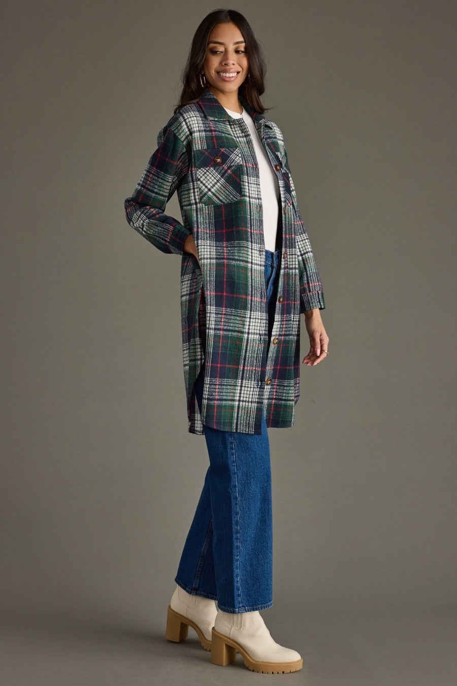 Side view of Manchester Plaid Long Flannel featuring a green, gray, and red plaid pattern with relaxed longline fit.