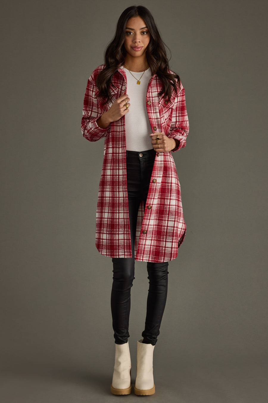 Full-length front view of woman wearing Panache Apparel’s Winston Plaid Long Flannel in red and ivory plaid with button-front closure.