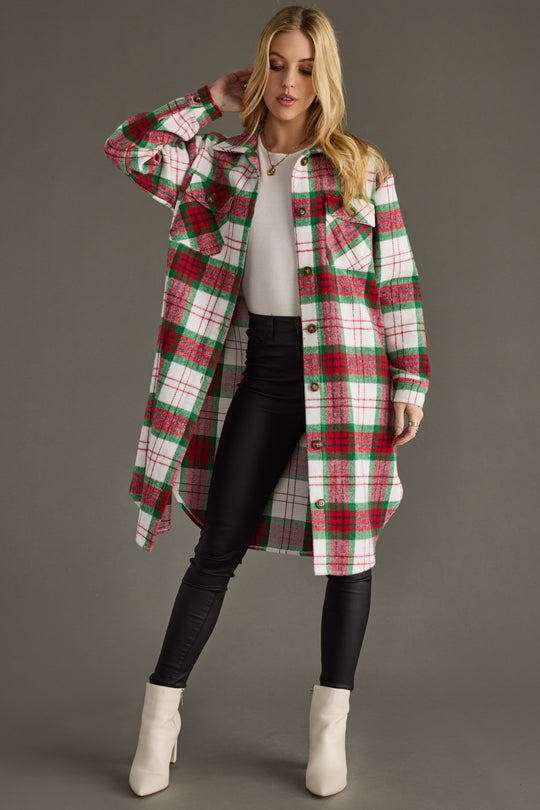 Woman modeling Piper Plaid Long Flannel open, featuring chest pockets, long sleeves, and a relaxed longline fit.