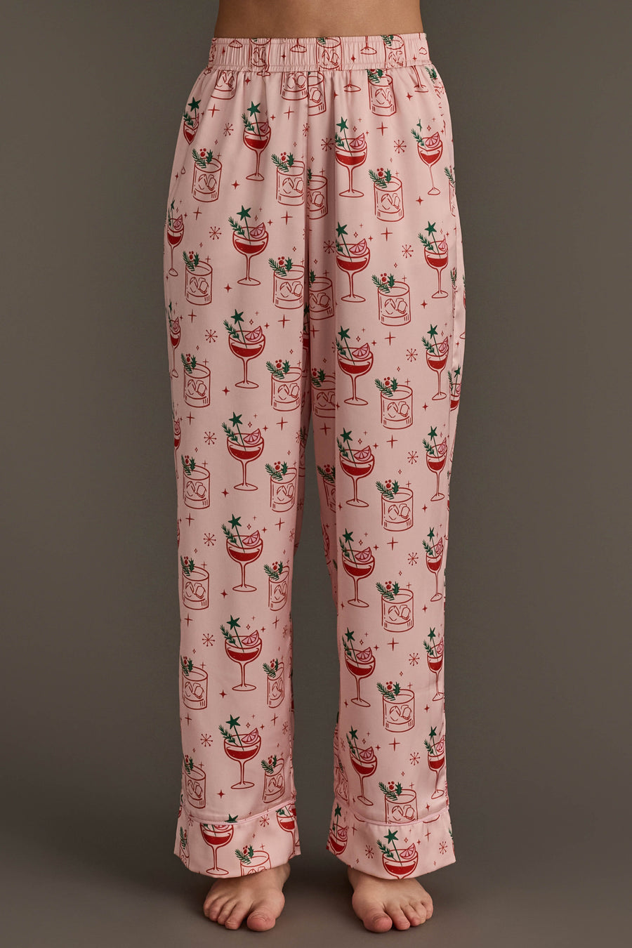 Light Pink Christmas Cocktails Satin Pajama Set pants in light pink satin featuring a pattern of Christmas cocktail glasses with garnishes.