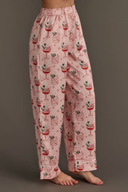 Light Pink Christmas Cocktails Satin Pajama set pants in light pink with a repeating pattern of holiday cocktails, lime slices, and small stars.