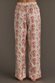 Ivory Christmas Cocktails Satin Pajama Set featuring cream-colored pajama pants with a festive print of cocktails, candy canes, and holly sprigs for holiday lounging.
