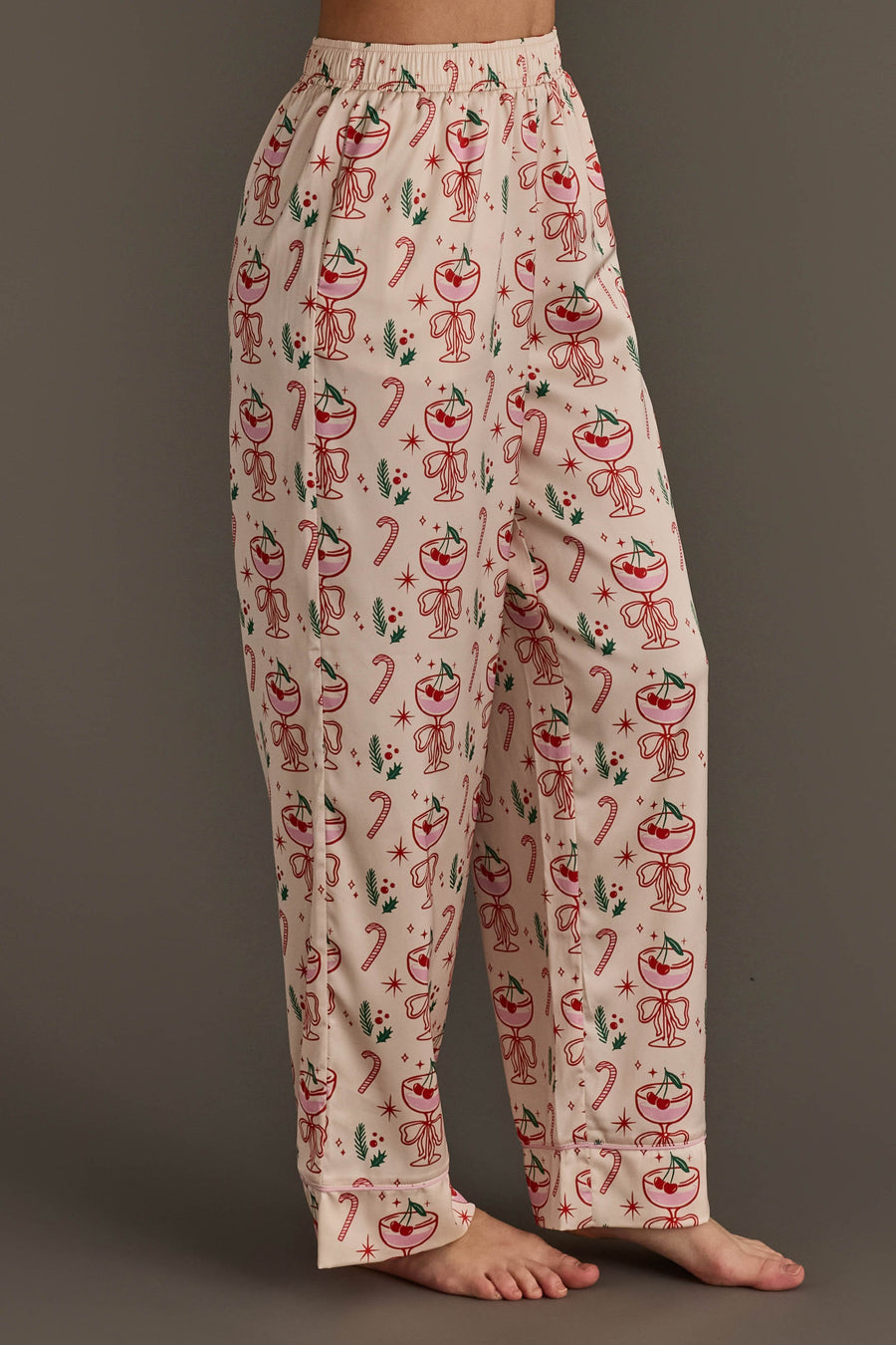 Ivory Christmas Cocktails Satin Pajama Set featuring ivory pajama pants with a festive cocktail print of candy canes and holly leaves, perfect for holiday lounging.
