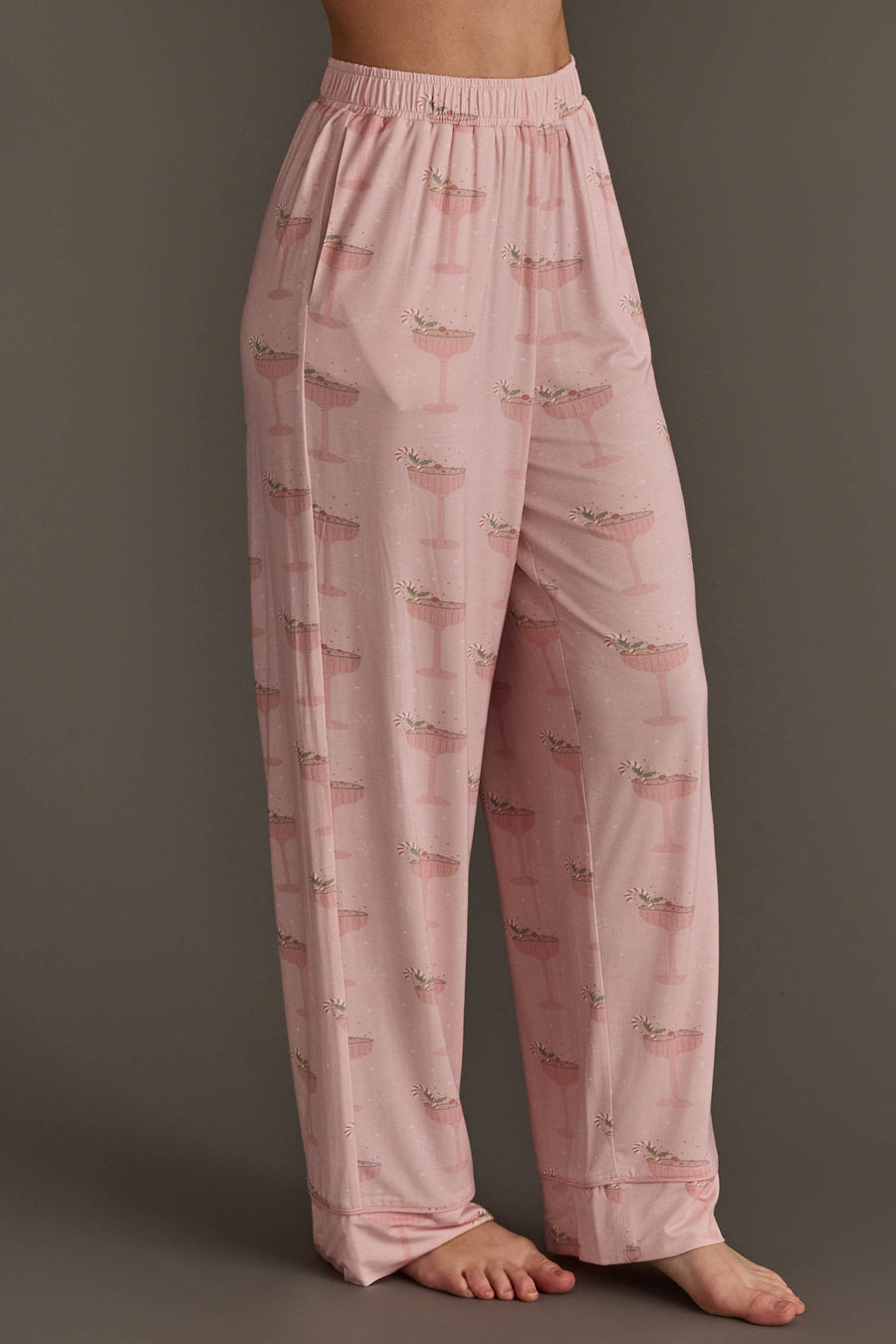 Pale pink Christmas Cocktails Jersey Pajama Set pants featuring an all-over festive cocktail print, perfect as holiday loungewear.