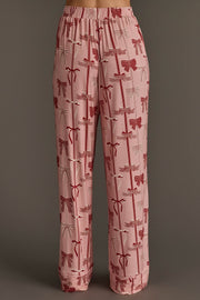 Bows Jersey Pajama Set pale pink jersey pajama pants with a festive red bow print and an elasticized waistband.