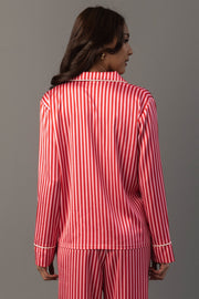 A person wearing a Panache Apparel Collection Red & Pink Striped Satin Pajama Set featuring a red and pink vertical stripe pattern.