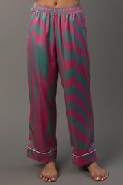 Pink & Green Striped Satin Pajama Set featuring satin pajama pants with pink and green vertical stripes, an elastic waistband, and white trim at the hems.