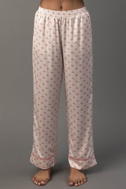 Ivory & Red Ho Ho Ho Satin Pajama Set pants in ivory satin with a red ho pattern and red hem trim.