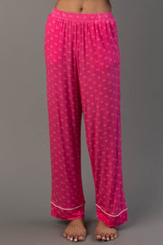 Pink & Light Pink Ho Ho Ho Jersey Pajama Set bright pink pajama pants with a repeating ho pattern and white piping at the ankles.