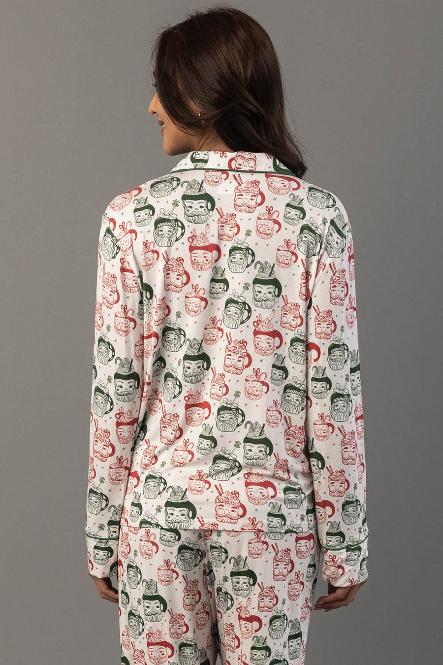 Back view of a person wearing an Ivory Santa Mugs Jersey Pajama Set in white, featuring a repeating print of Santa Claus and candy canes.