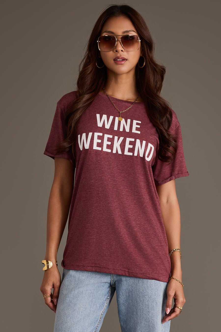 A person wears a burgundy Wine Weekend Tee by Panache Apparel Collection with the words printed in white across the chest.