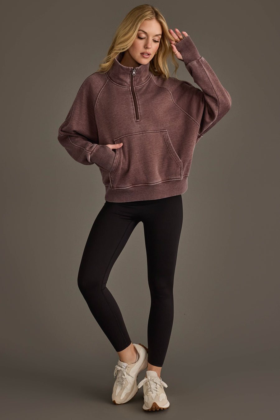 Full-length view of woman wearing Panache Apparel’s reddish-brown quarter zip sweatshirt.