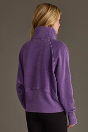 Back view of woman wearing Panache Apparel’s dark purple quarter zip sweatshirt.