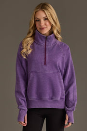 Woman wearing Panache Apparel’s dark purple quarter zip sweatshirt.