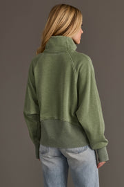Back view of woman wearing Panache Apparel’s sage quarter zip sweatshirt.