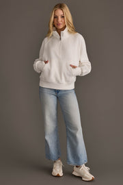 Full-length view of Panache Apparel’s white quarter zip sweatshirt.